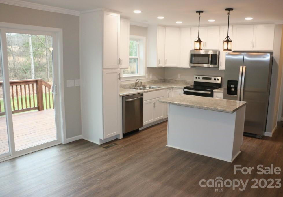 314 John Smith Road Rutherfordton, NC 28139 - Photo 14 of 25 a kitchen with stainless steel appliances granite countertop a refrigerator a stove a sink and a microwave