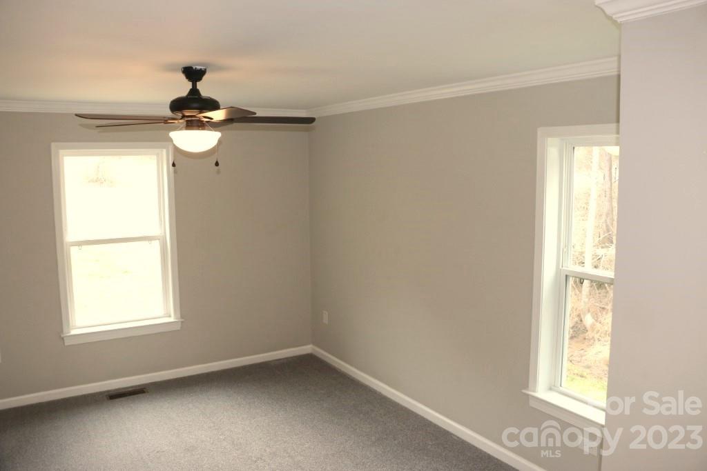 314 John Smith Road Rutherfordton, NC 28139 - Photo 18 of 25 an empty room with windows and fan