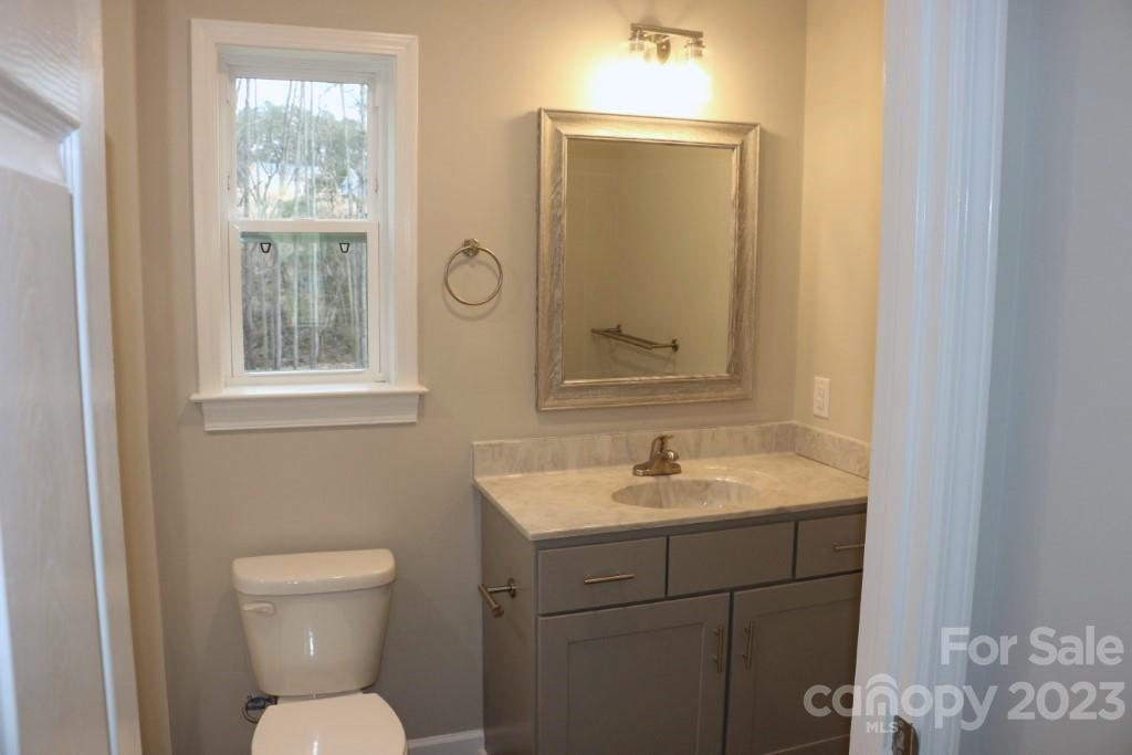 314 John Smith Road Rutherfordton, NC 28139 - Photo 19 of 25 a bathroom with a toilet sink and mirror