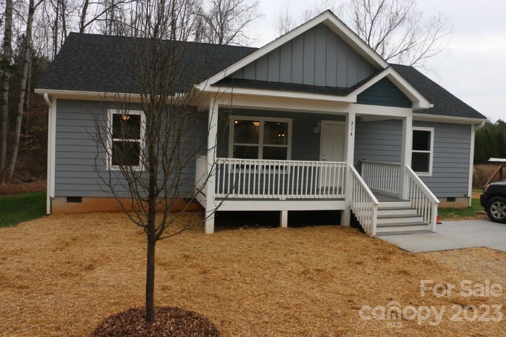 314 John Smith Road Rutherfordton, NC 28139 - Photo 2 of 25 a front view of a house with a yard
