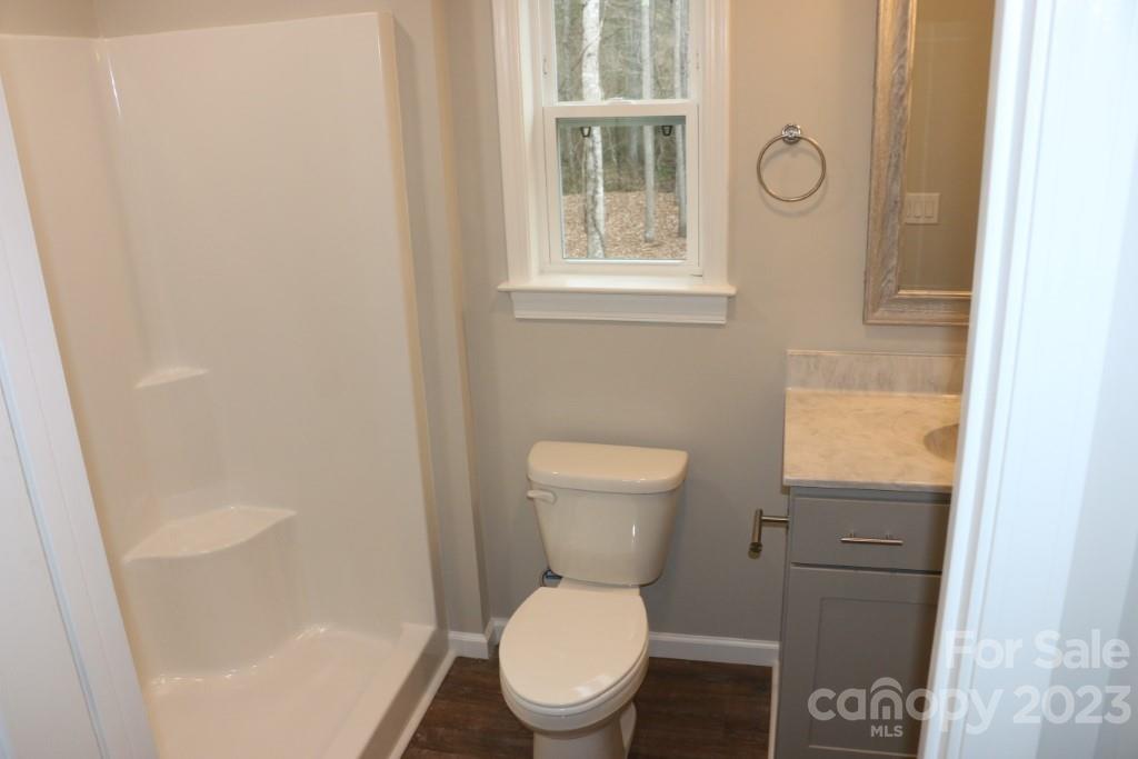 314 John Smith Road Rutherfordton, NC 28139 - Photo 21 of 25 a white toilet sitting next to a bathroom sink and tub