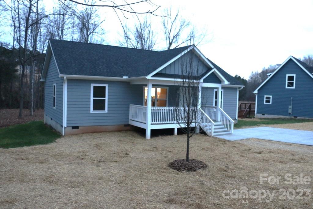 314 John Smith Road Rutherfordton, NC 28139 - Photo 4 of 25 a house that has a wooden bench in front of it