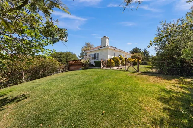 a view of a house with a big yard
