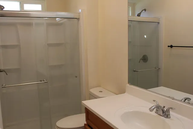 a big house with a big yard and large trees