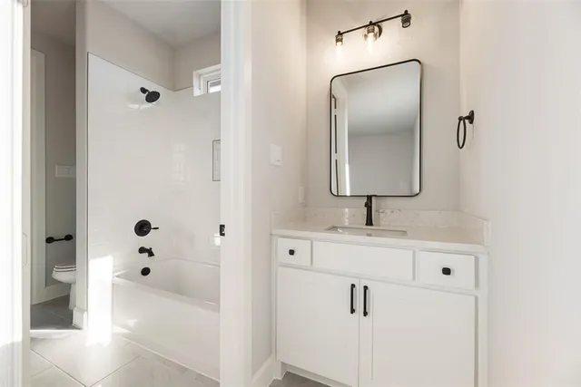 a bathroom with a sink and mirror