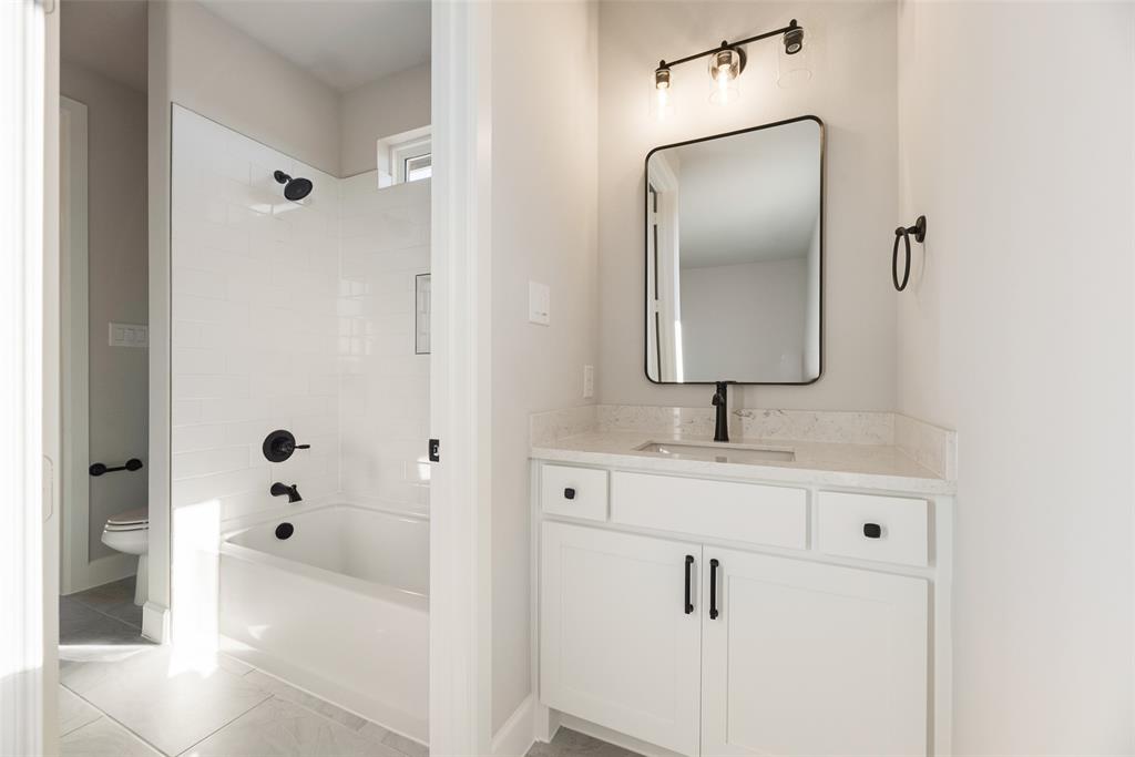 5251 Sunset Road Caddo Mills, TX 75135 - Photo 16 of 32 a bathroom with a sink and mirror