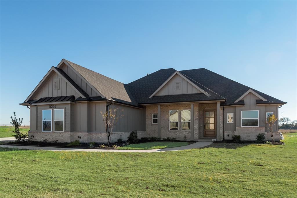 5251 Sunset Road Caddo Mills, TX 75135 - Photo 2 of 32 a front view of a house with a garden