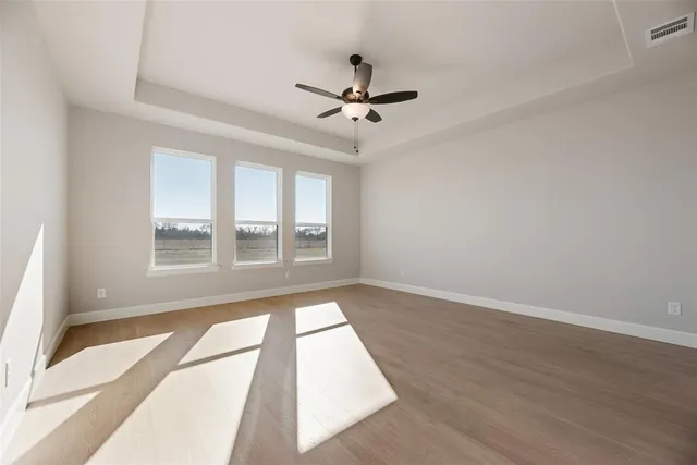 a view of a room with a ceiling fan
