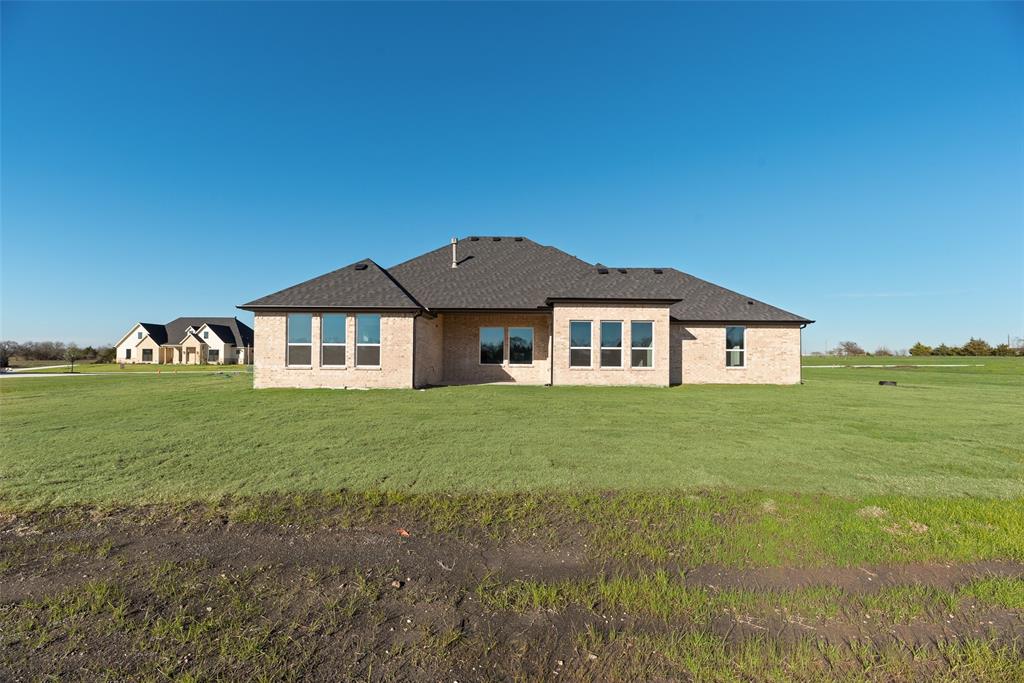 5251 Sunset Road Caddo Mills, TX 75135 - Photo 29 of 32 a front view of a house with garden