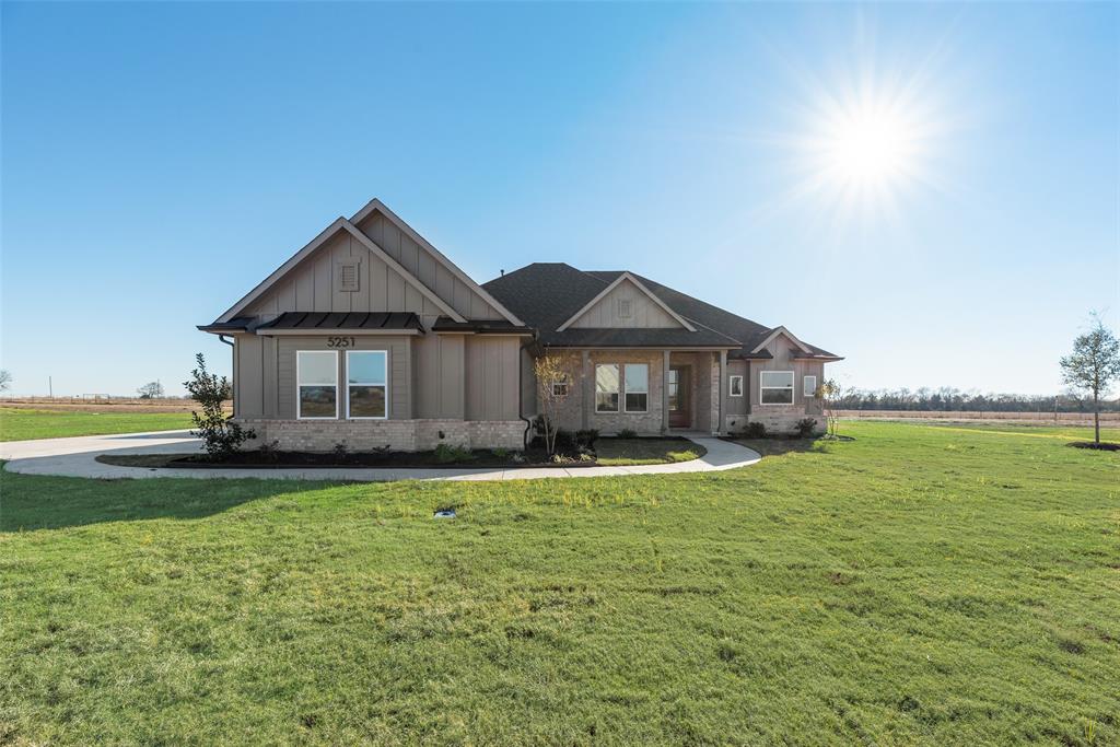 5251 Sunset Road Caddo Mills, TX 75135 - Photo 4 of 32 a front view of a house with a yard