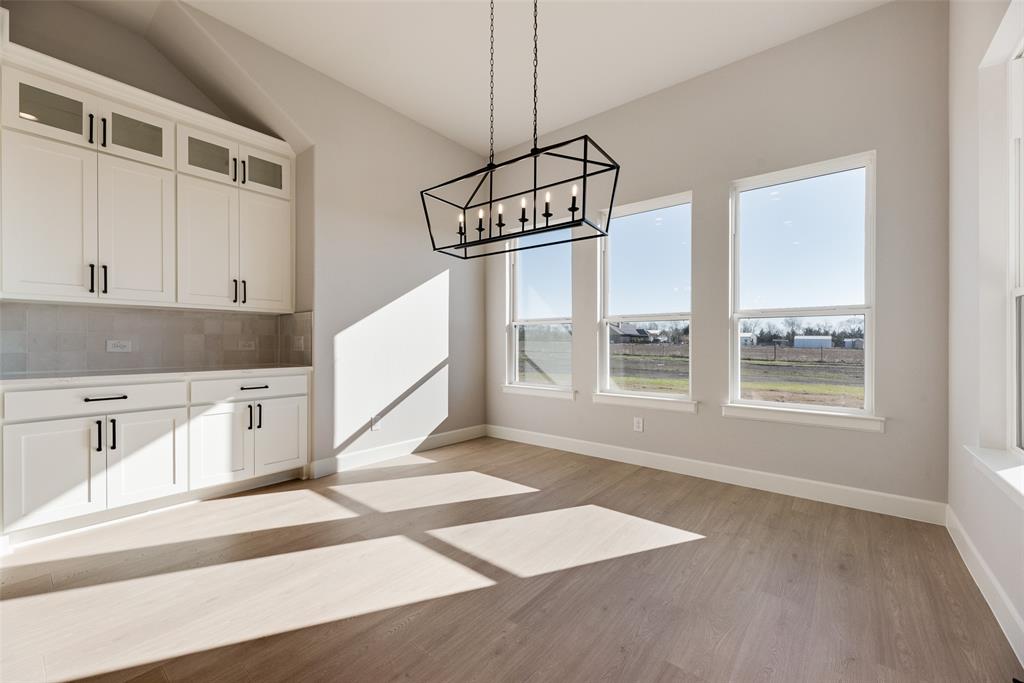 5251 Sunset Road Caddo Mills, TX 75135 - Photo 9 of 32 a kitchen with stainless steel appliances granite countertop a stove a sink and a refrigerator