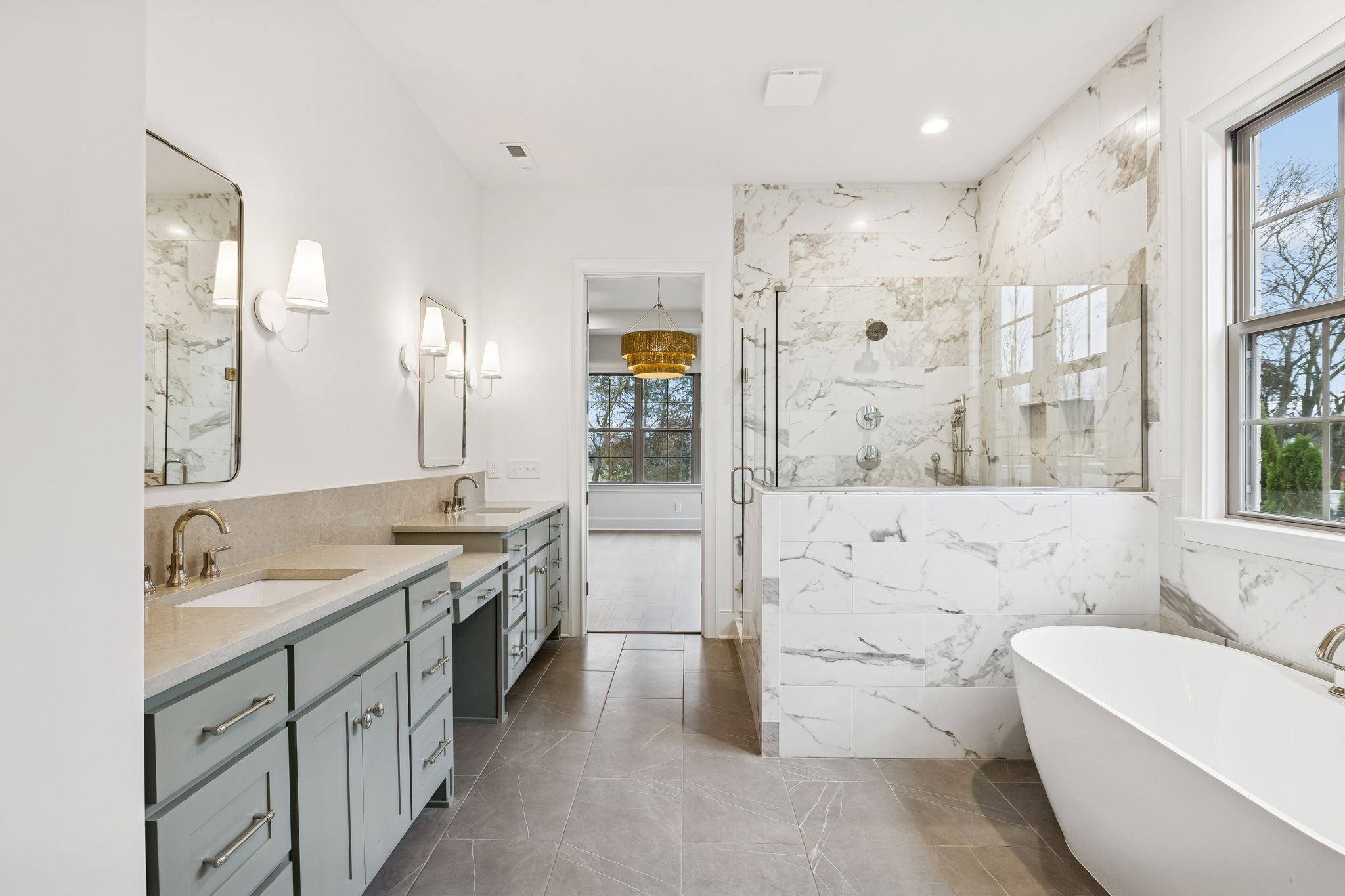 209 Bellsford Road Gallatin, TN 37066 - Photo 34 of 68 a spacious bathroom with a granite countertop tub sink a mirror a shower and vanity