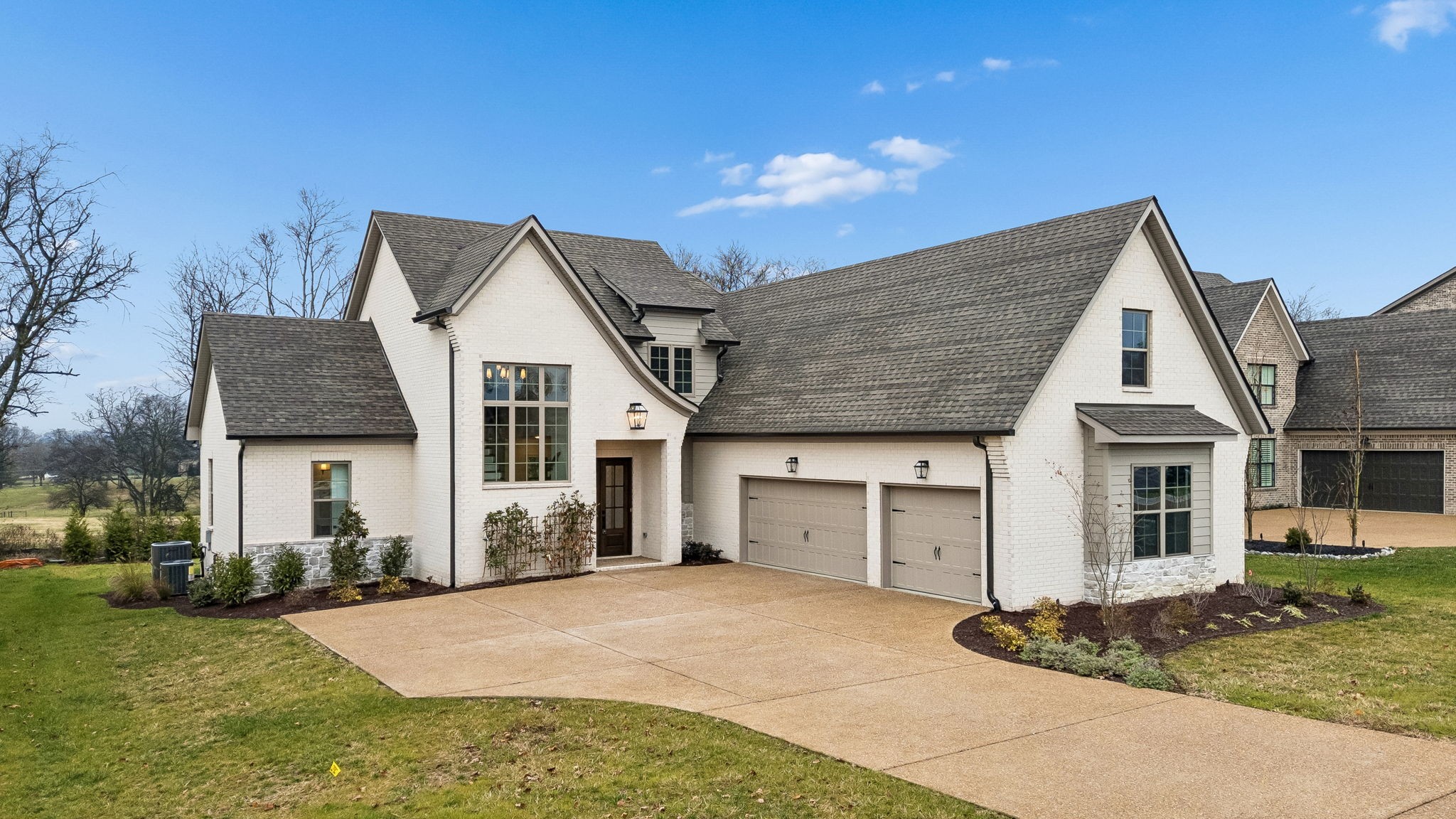209 Bellsford Road Gallatin, TN 37066 - Photo 4 of 68 a front view of a house with a yard and garage