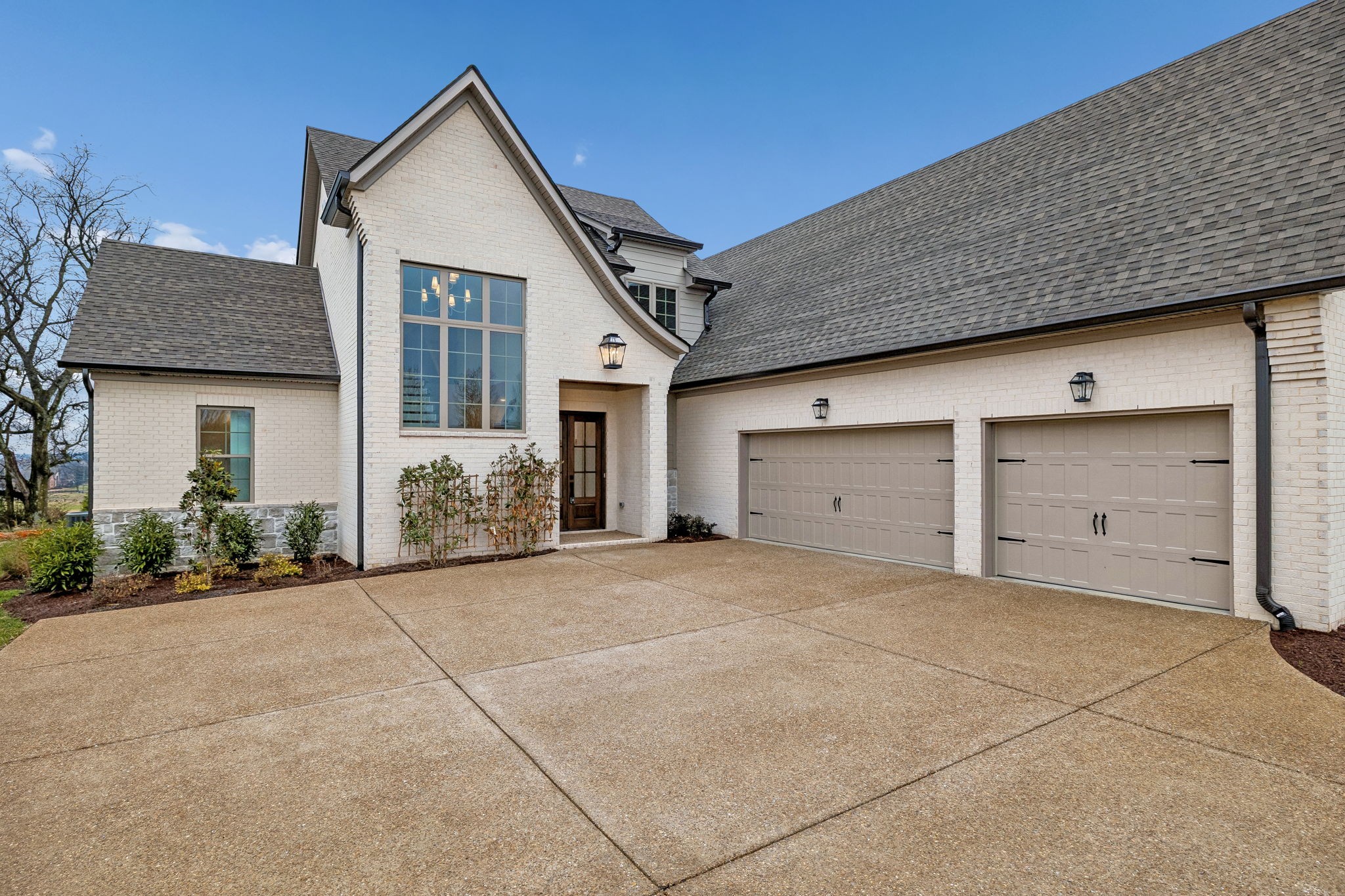 209 Bellsford Road Gallatin, TN 37066 - Photo 7 of 68 a view of a house with a garage and front door