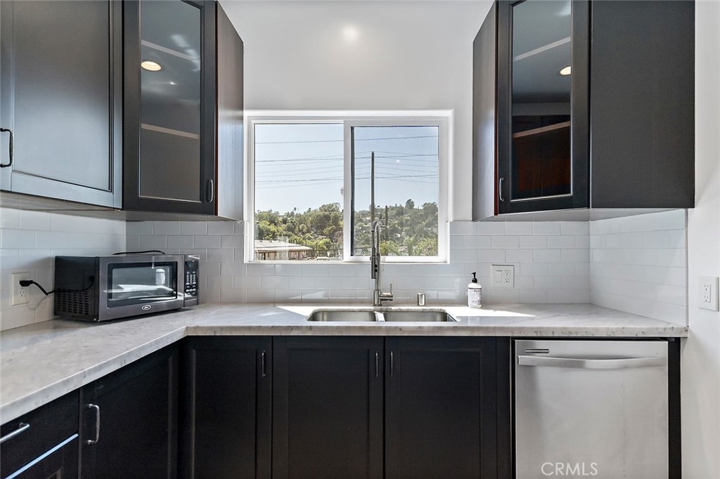 4620 Eagle Rock Boulevard, Unit 1/2 Eagle Rock, CA 90041 - Photo 6 of 26 a kitchen with granite countertop a sink cabinets and window