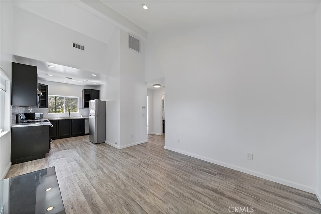 4620 Eagle Rock Boulevard, Unit 1/2 Eagle Rock, CA 90041 - Photo 8 of 26 a large kitchen with a wooden floor and a large window