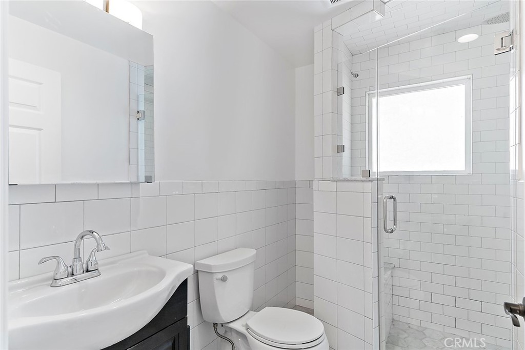 4620 Eagle Rock Boulevard, Unit 1/2 Eagle Rock, CA 90041 - Photo 9 of 26 a bathroom with a sink toilet and shower