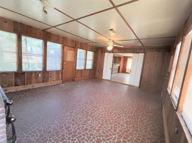 a view of hallway with windows