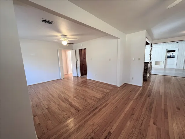a view of a livingroom with wooden floor