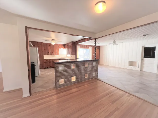a view of kitchen with wooden floor