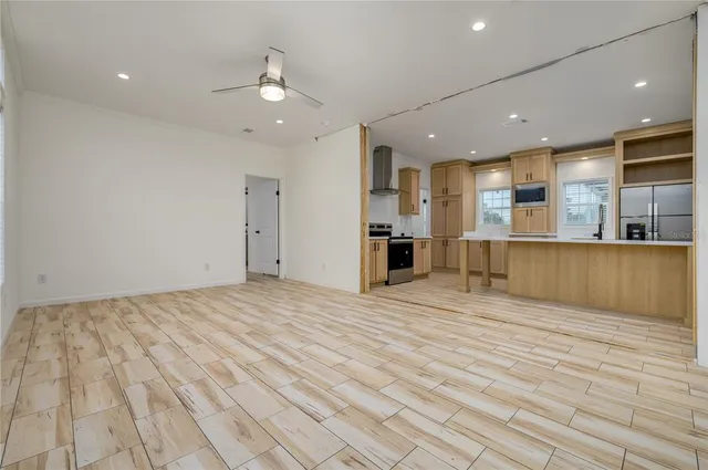 a view of a kitchen with a sink and a refrigerator