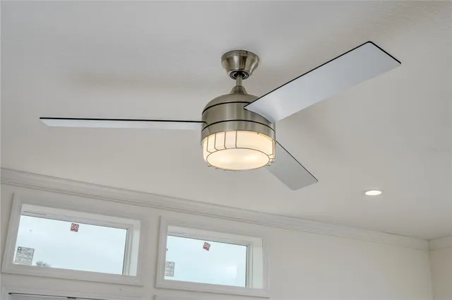 a view of a chandelier fan and a mirror