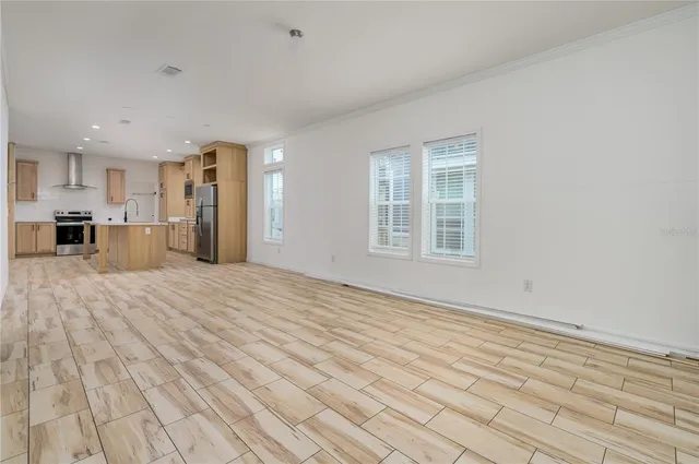 a view of a kitchen with a sink and a window