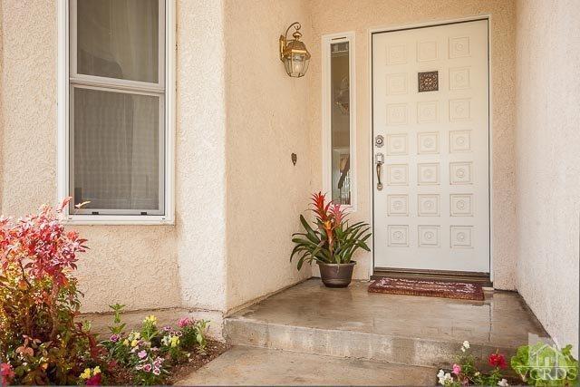 4347 Laurelhurst Road Moorpark, CA 93021 - Photo 2 of 23 a view of a potted plant in front of a door