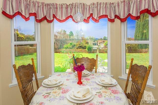 4347 Laurelhurst Road Moorpark, CA 93021 - Photo 11 of 23 a view of a dining room with furniture window and wooden floor