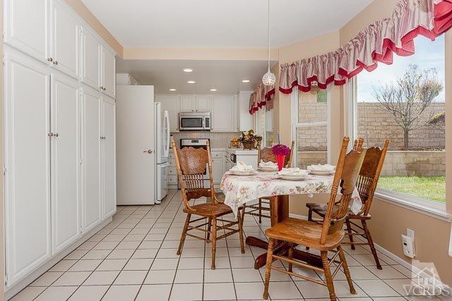 4347 Laurelhurst Road Moorpark, CA 93021 - Photo 12 of 23 a view of a dining room with furniture and a chandelier