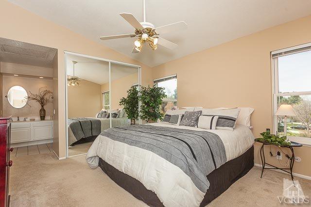 4347 Laurelhurst Road Moorpark, CA 93021 - Photo 14 of 23 a spacious bedroom with a bed and a chandelier