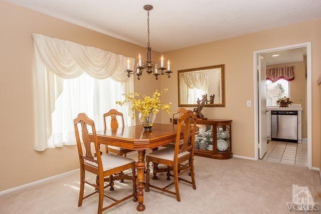 4347 Laurelhurst Road Moorpark, CA 93021 - Photo 5 of 23 a view of a dining room with furniture and chandelier