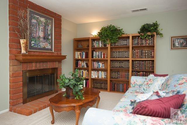 4347 Laurelhurst Road Moorpark, CA 93021 - Photo 7 of 23 a living room with furniture and a fireplace