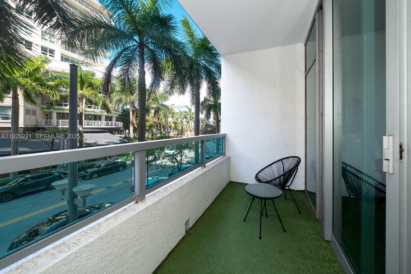 3301 Northeast 1st Avenue, Unit M0201 Miami, FL 33137 - Photo 12 of 20 a view of a chair and table in the balcony