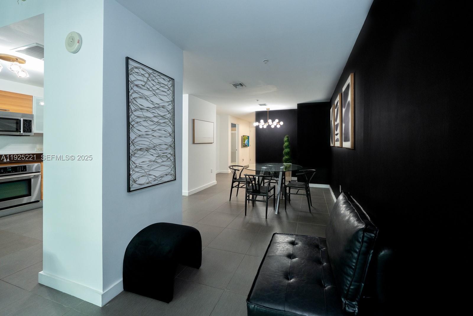 3301 Northeast 1st Avenue, Unit M0201 Miami, FL 33137 - Photo 5 of 20 a view of a entryway with livingroom and furniture