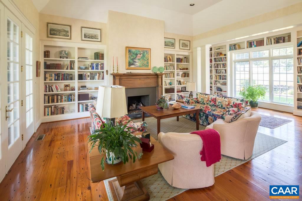 4054 Garth Road Crozet, VA 22932 - Photo 13 of 50 a living room with furniture and a fireplace