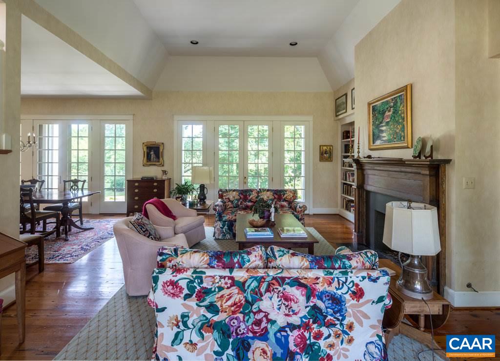 4054 Garth Road Crozet, VA 22932 - Photo 16 of 50 a living room with furniture and a fireplace