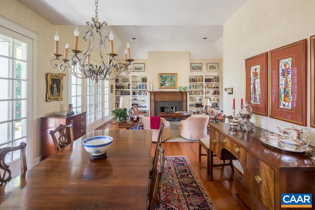 4054 Garth Road Crozet, VA 22932 - Photo 18 of 50 a living room with fireplace furniture and a chandelier
