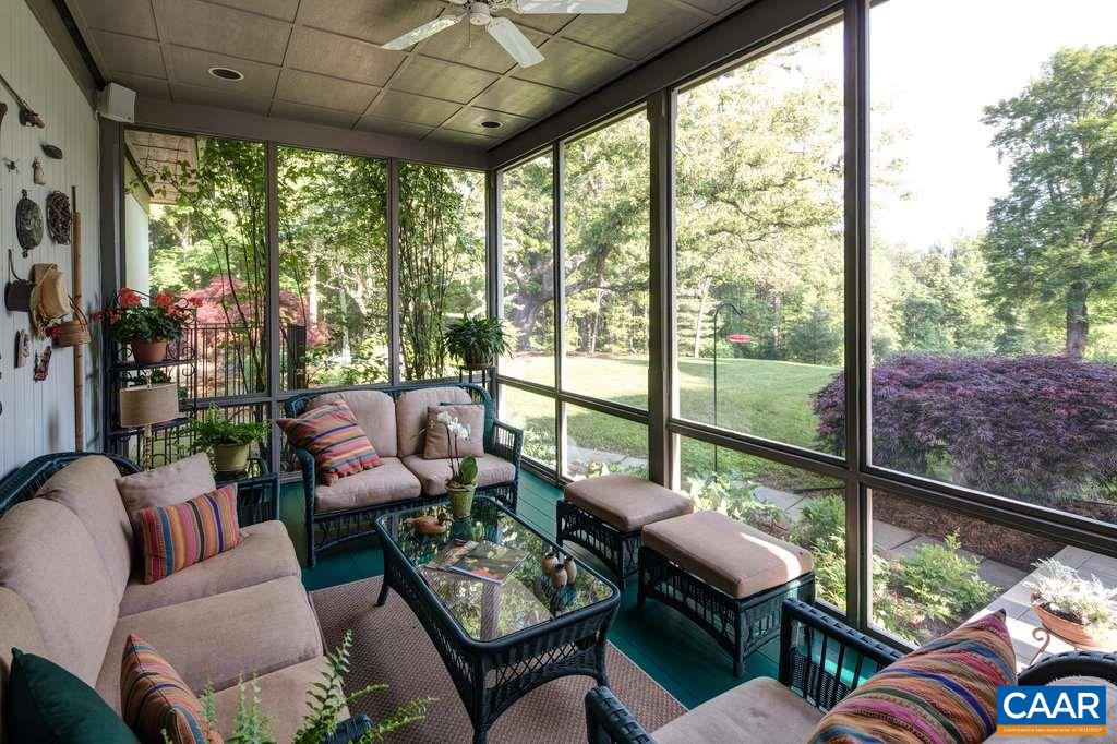 4054 Garth Road Crozet, VA 22932 - Photo 22 of 50 a living room with furniture and a floor to ceiling window