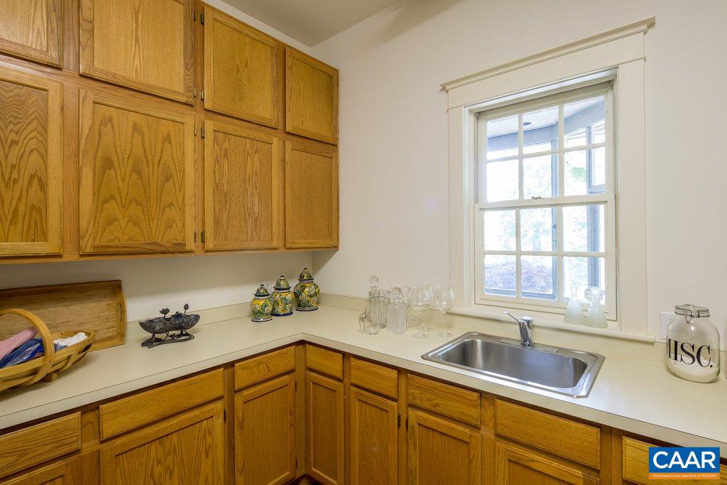 4054 Garth Road Crozet, VA 22932 - Photo 23 of 50 a kitchen with a sink cabinets and a window