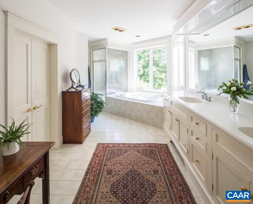 4054 Garth Road Crozet, VA 22932 - Photo 28 of 50 a large white kitchen with a large window