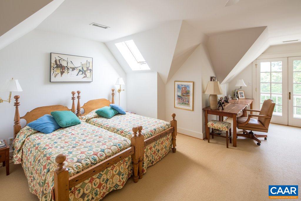 4054 Garth Road Crozet, VA 22932 - Photo 29 of 50 a bedroom with two beds and glass table