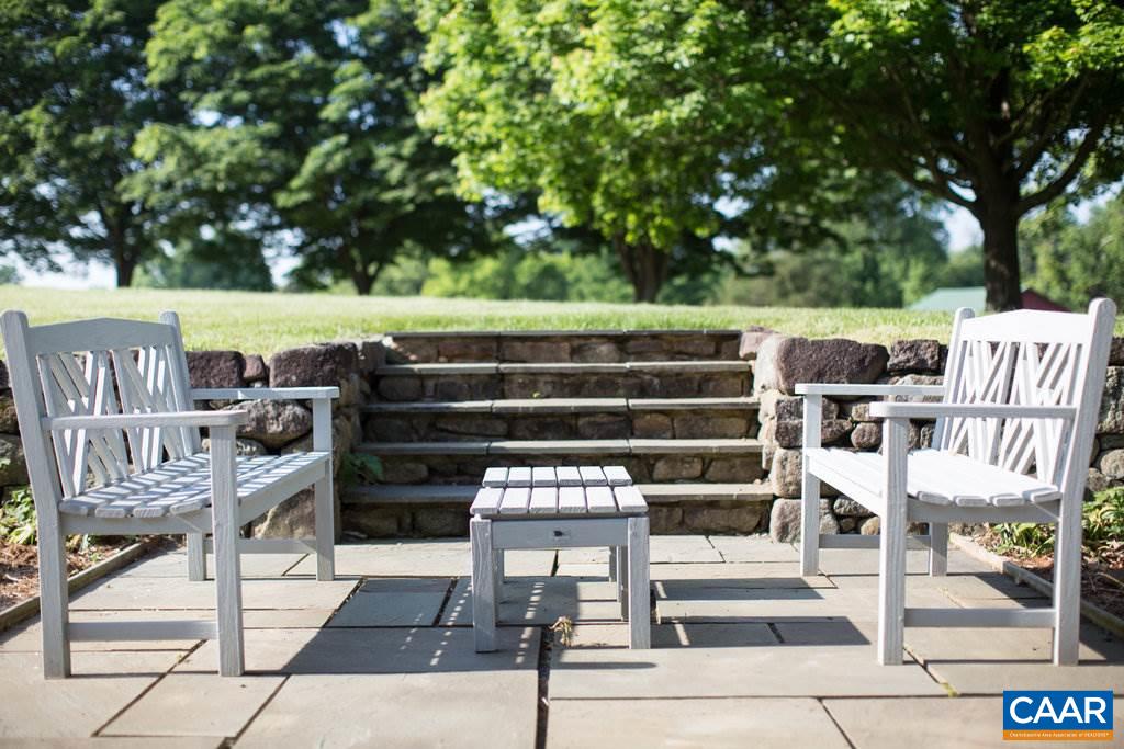 4054 Garth Road Crozet, VA 22932 - Photo 8 of 50 a view of a chairs and tables in the back yard