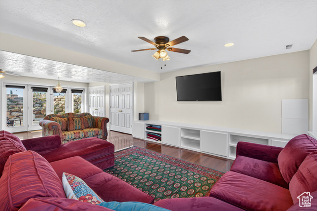 4768 East Hickman Canyon Road Stockton, UT 84071 - Photo 37 of 85 Basement living room featuring a ceiling fan, wood style floors, recessed lighting.