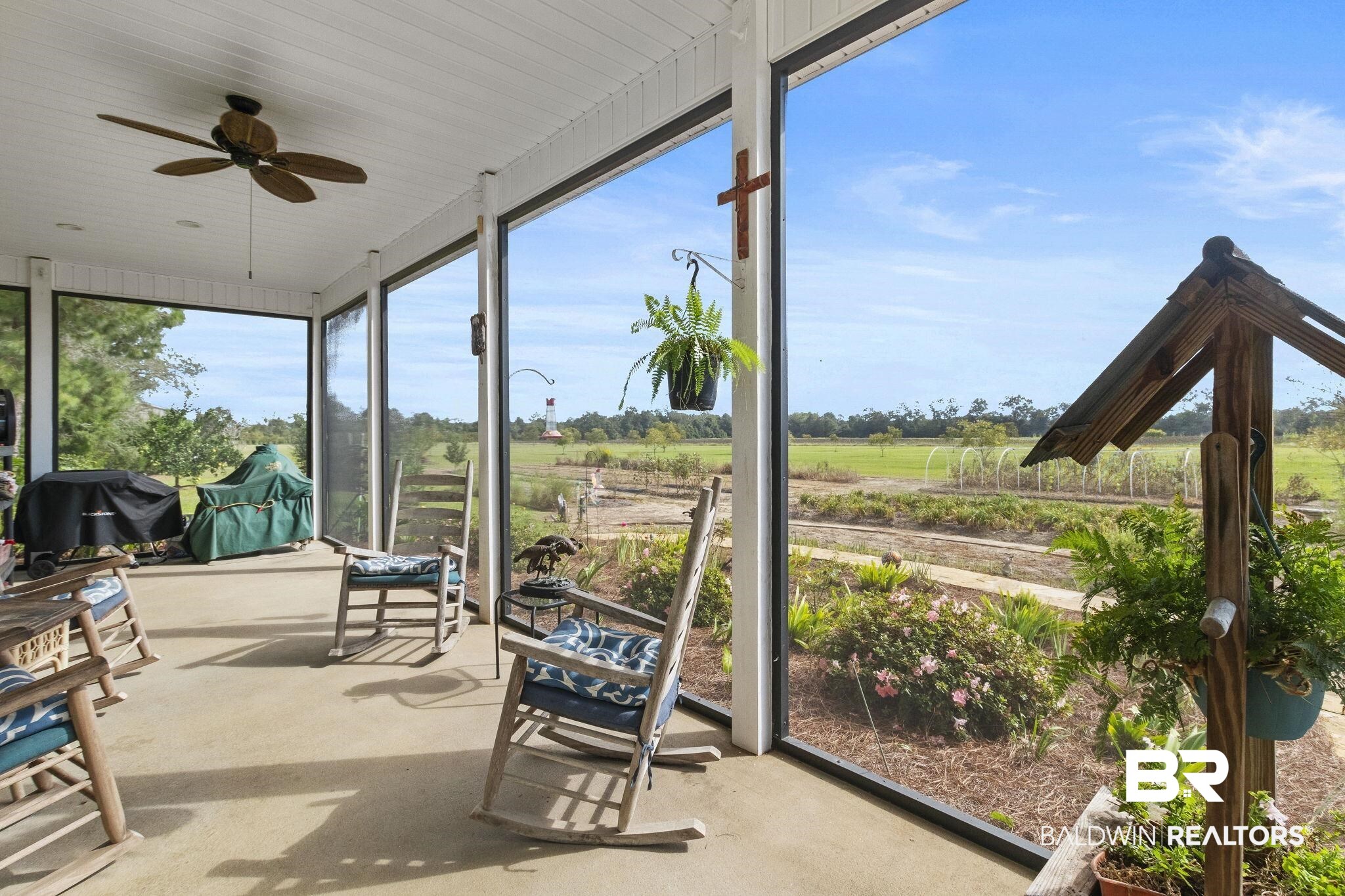 26071 Woerner Road Elberta, AL 36530 - Photo 46 of 86 Sunroom featuring a ceiling fan and a rural view