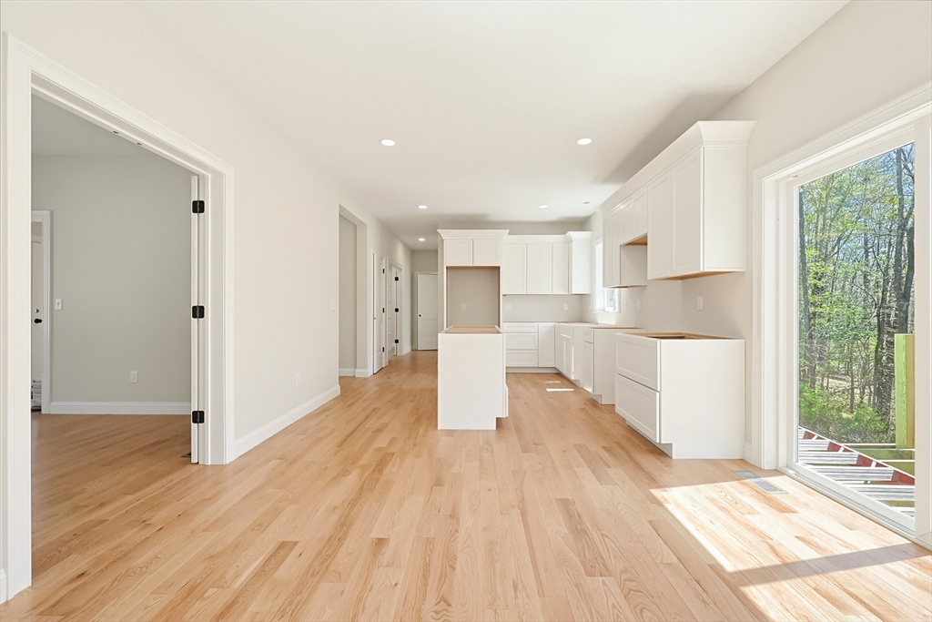 112 West Meadow Road Townsend, MA 01474 - Photo 6 of 38 a view of kitchen with wooden floor and electronic appliances