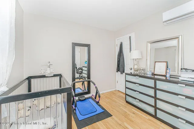 a bedroom with furniture and a window