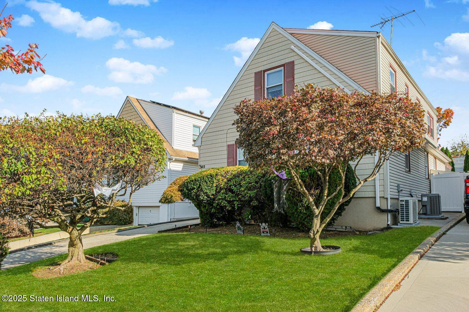 45 Lenevar Avenue Staten Island, NY 10309 - Photo 2 of 35 a front view of a house with a yard