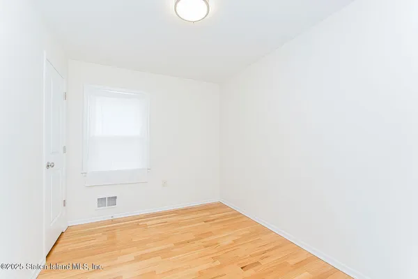 a view of a room with a window