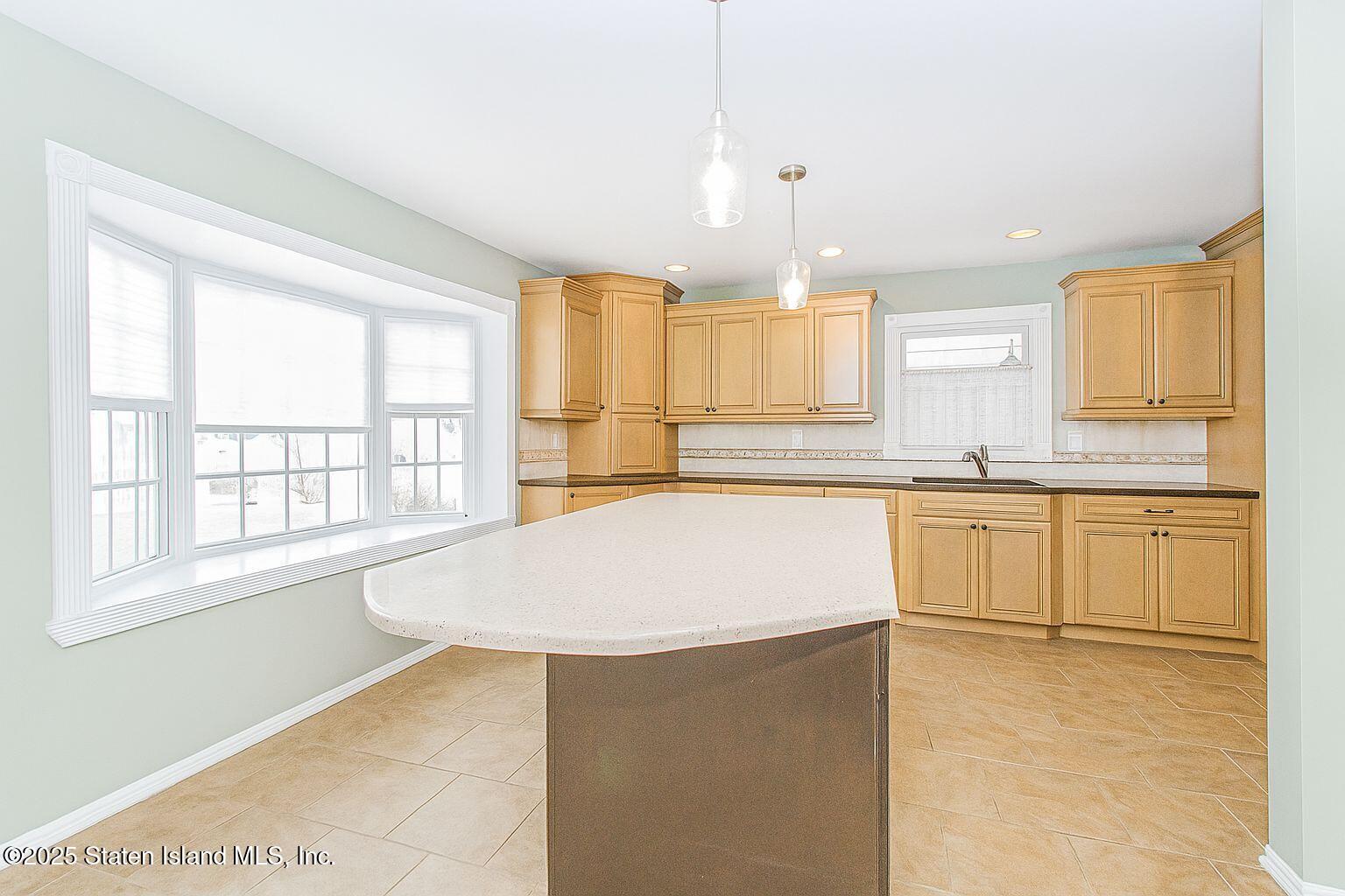 45 Lenevar Avenue Staten Island, NY 10309 - Photo 22 of 35 a kitchen with stainless steel appliances granite countertop a stove a sink and a microwave
